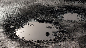 Most Common Causes of Parking Lot Potholes